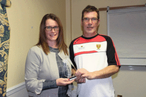 Paula Magee accepts Aoife's award from Paul Rooney